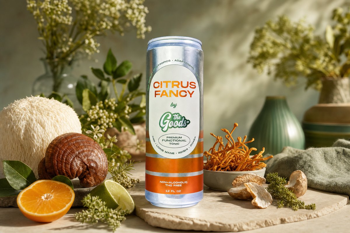 Citrus Fancy functional tonic can surrounded by lion's mane, reishi, cordyceps mushrooms, citrus, and herbs.