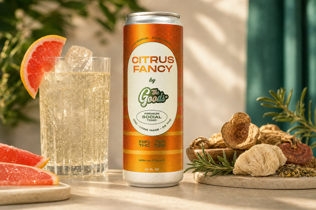 Citrus Fancy social tonic can with THC and CBD beside a sparkling grapefruit drink and mushrooms with rosemary.