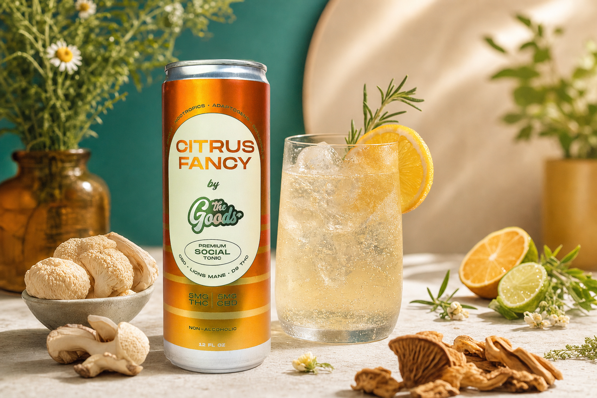 Citrus Fancy THC and CBD social tonic can beside an iced drink garnished with rosemary and orange, with lion's mane mushrooms and citrus.