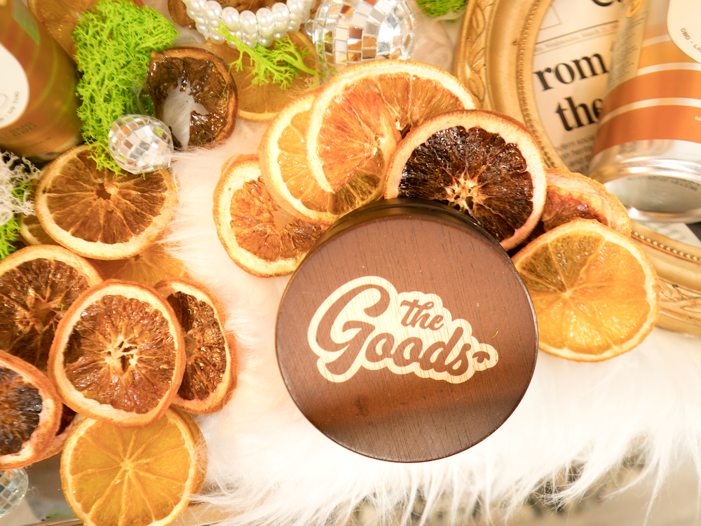 a grinder surrounded by orange slices