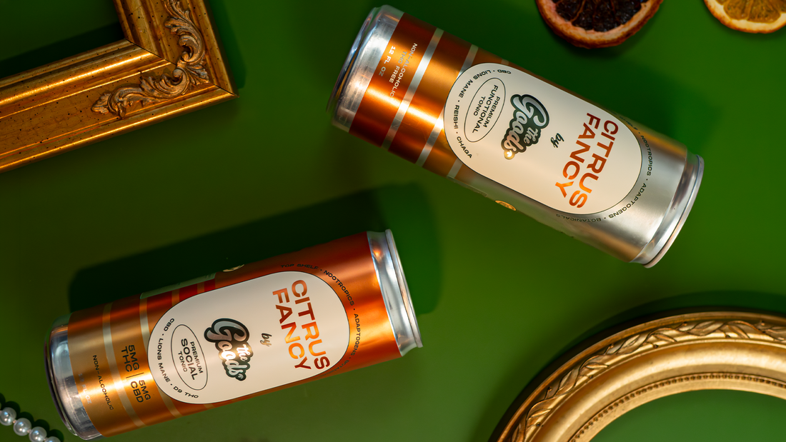 two cans of The Goods Citrus Fancy in front of a green background